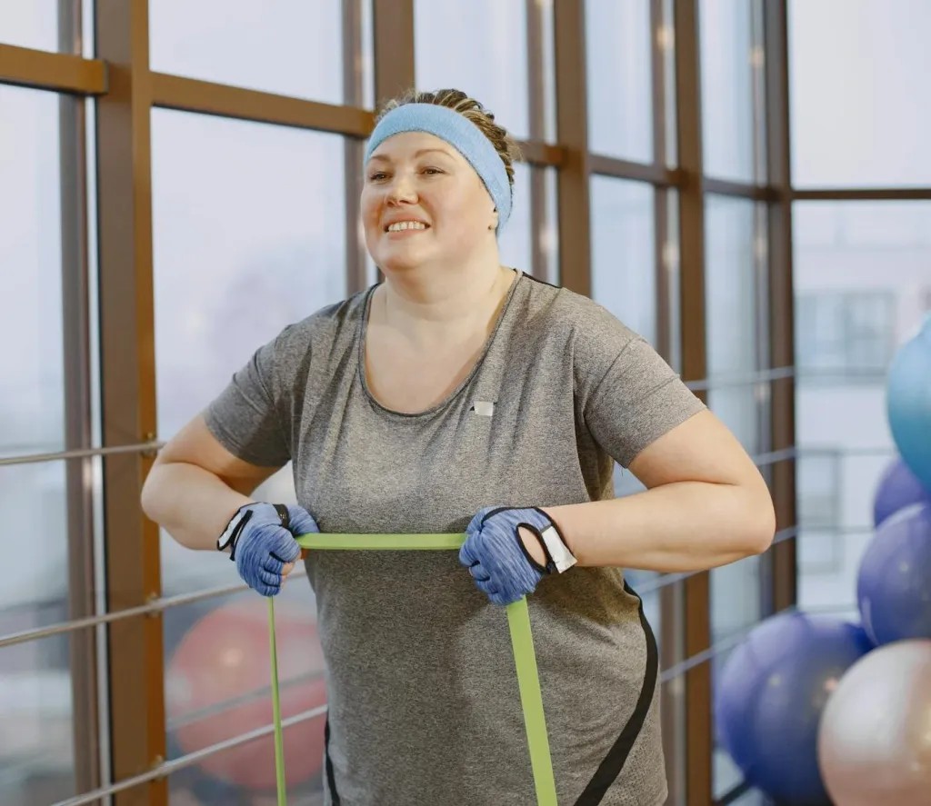A woman demonstrating stretch band exercise. 